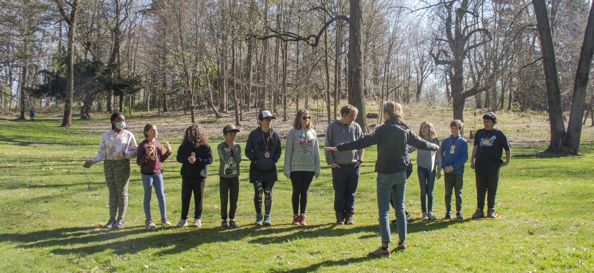 A Wayfinders mentor leading young people outdoors